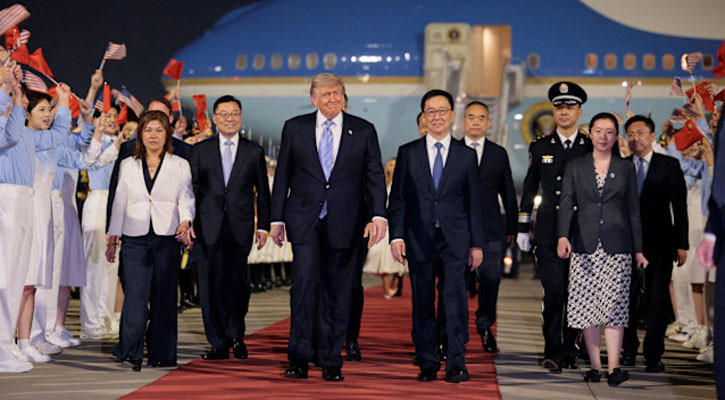 Trump arrives in China for superpower summit with Xi